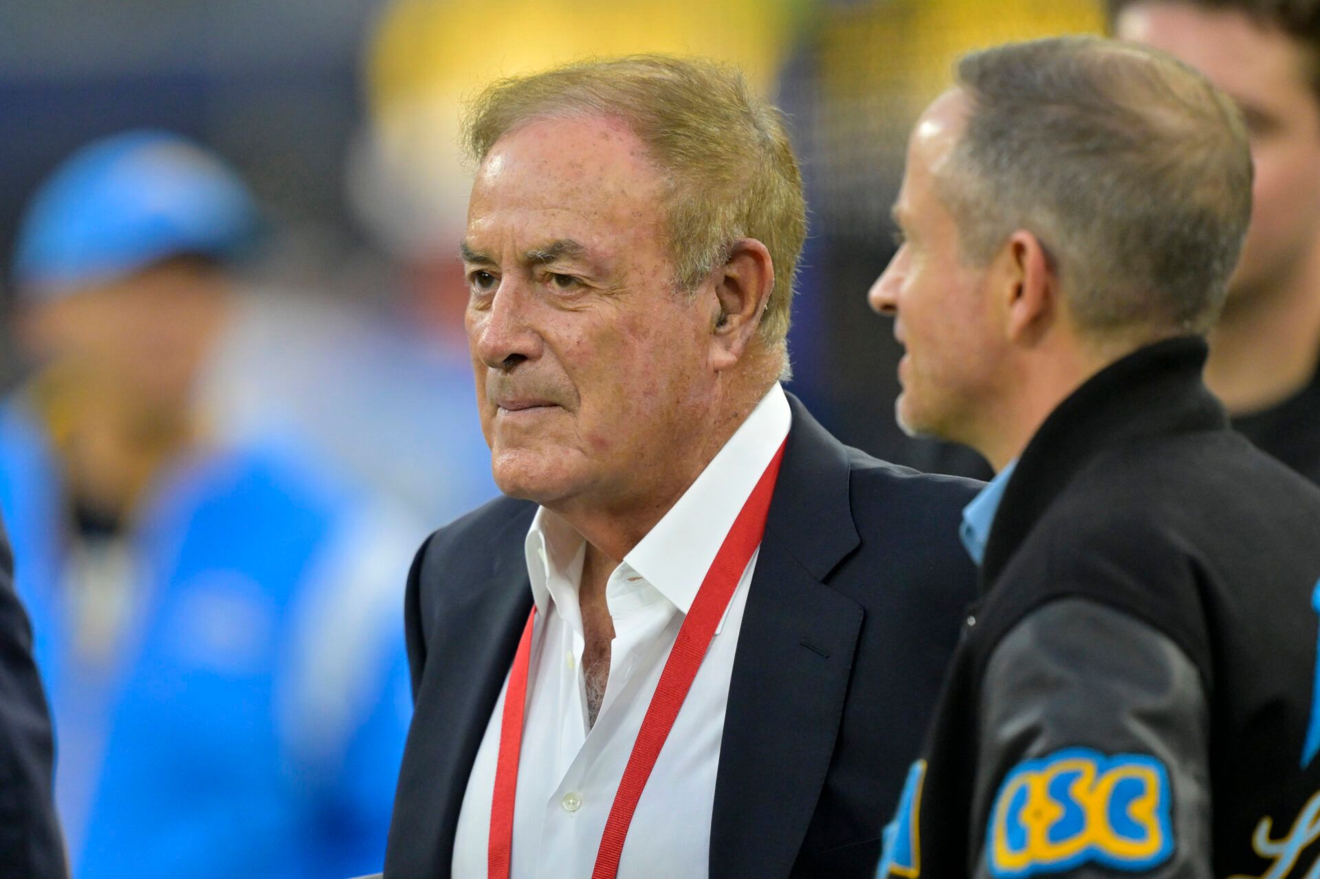 Sportscaster Al Michaels talks with Los Angeles Chargers President of football operations John Spanos prior to the game against the Denver Broncos at SoFi Stadium.