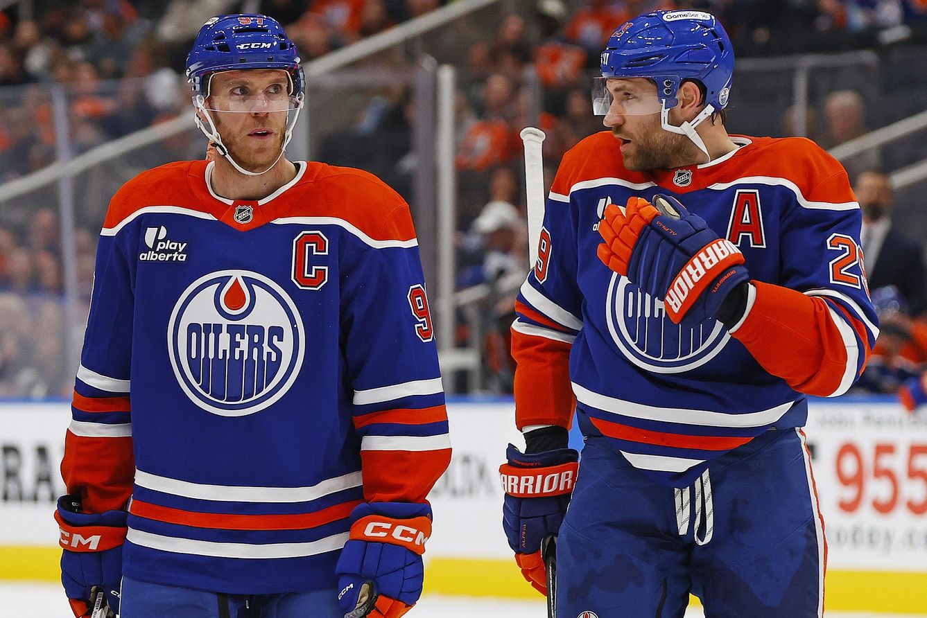Edmonton Oilers forward Connor McDavid (97) and forward Leon Draisaitl (29) discuss a play during a break in play against the Seattle Kraken at Rogers Place.