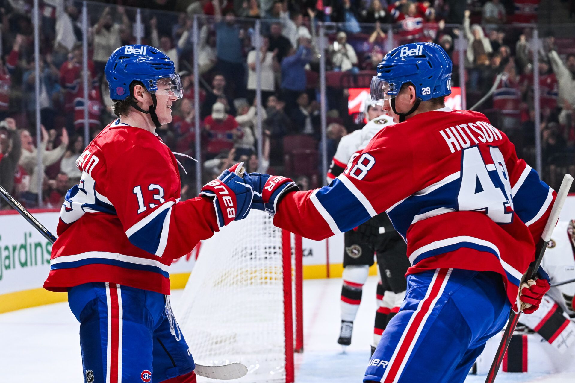 Montreal Canadiens right wing Cole Caufield (13) celebrates his goal against the Ottawa Senators with defenseman Lane Hutson (48) during the third period at Bell Centre.
