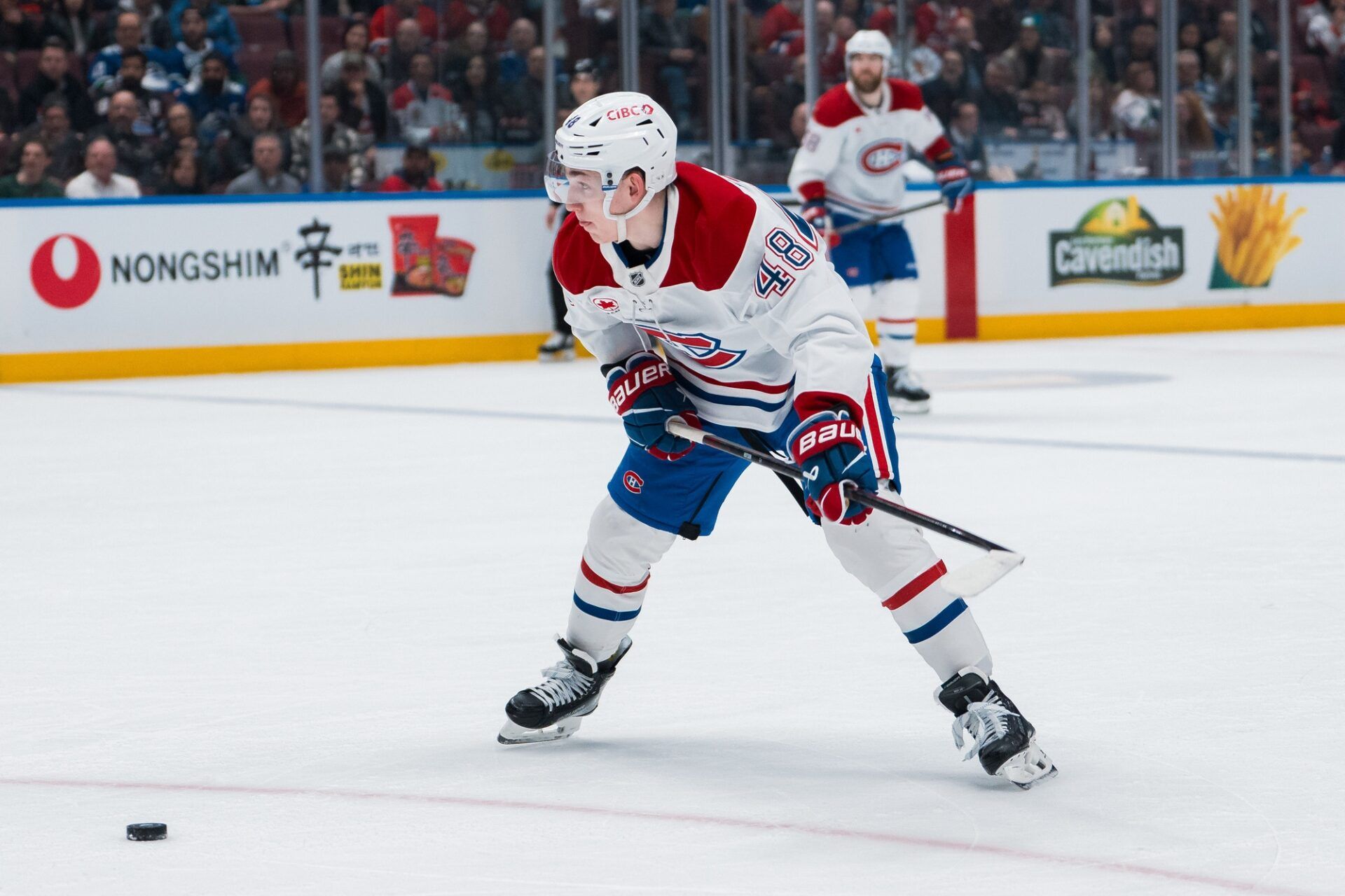 Montreal Canadiens defenseman Lane Hutson (48) shoots against the Vancouver Canucks in the third period at Rogers Arena.