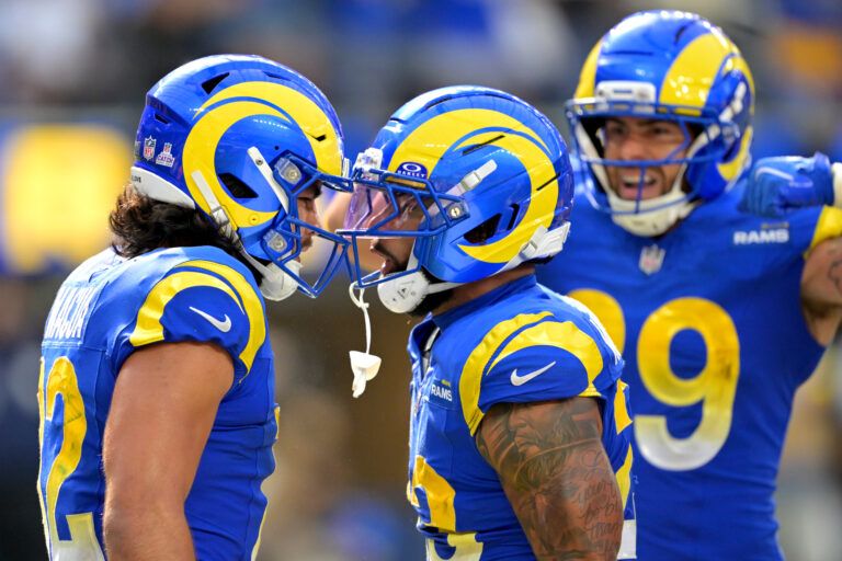 Los Angeles Rams wide receiver Puka Nacua (12) is congratulated by running back Blake Corum (22) after a touchdown in the second half at SoFi Stadium.