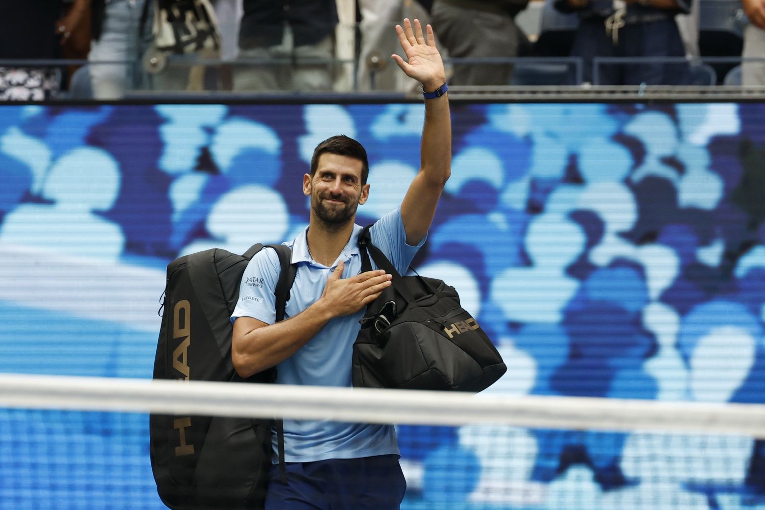 Novak Djokovic (SRB) waves to the crowd while leaving the court after his match against Carlos Alcaraz (ESP) (not pictured) in a men's singles semifinal on day thirteen of the 2025 US Open tennis championships at USTA Billie Jean King National Tennis Center.