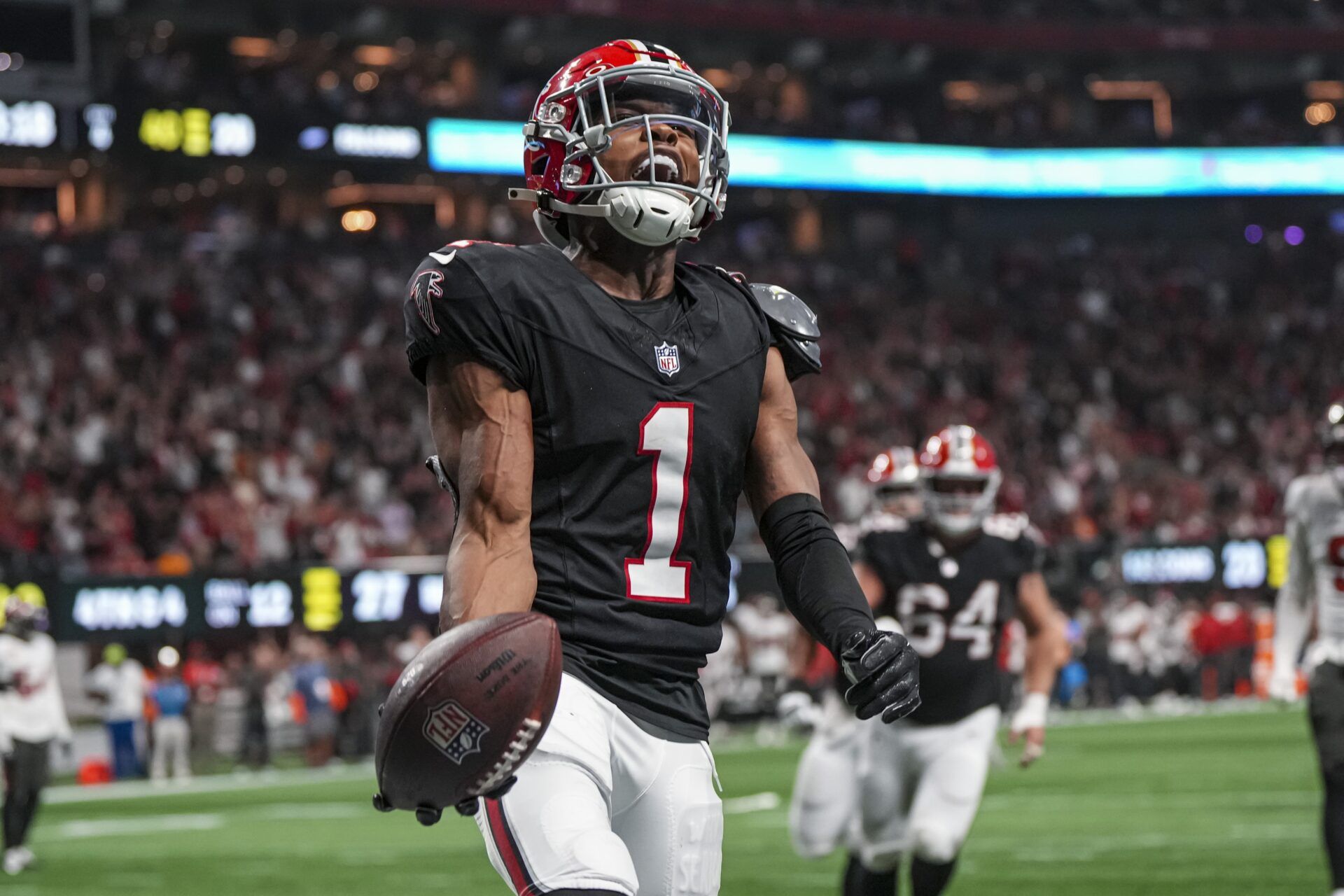 Atlanta Falcons wide receiver Darnell Mooney (1) reacts after scoring a touchdown against the Tampa Bay Buccaneers during the second half at Mercedes-Benz Stadium.