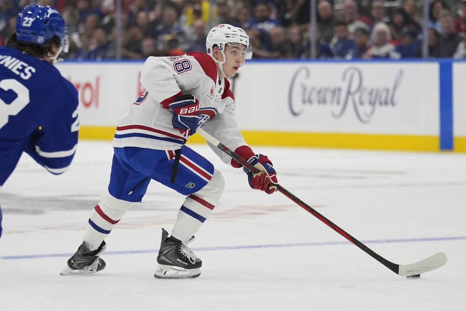 defenseman Lane Hutson (48) carries the puck against the Toronto Maple Leafs during the second period at Scotiabank Arena.