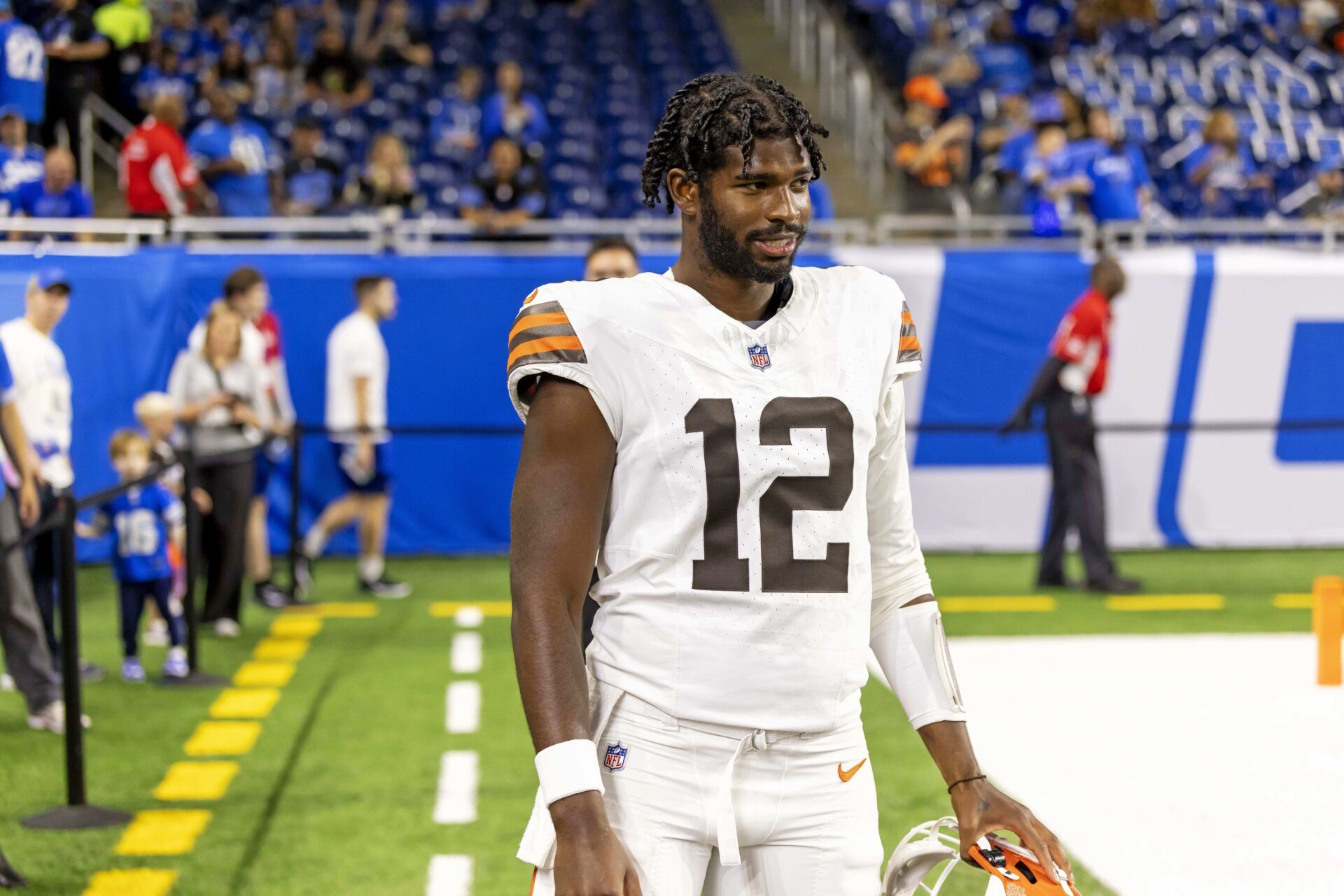 Cleveland Browns quarterback Shedeur Sanders (12) warms up before the game against the Detroit Lions at Ford Field.
