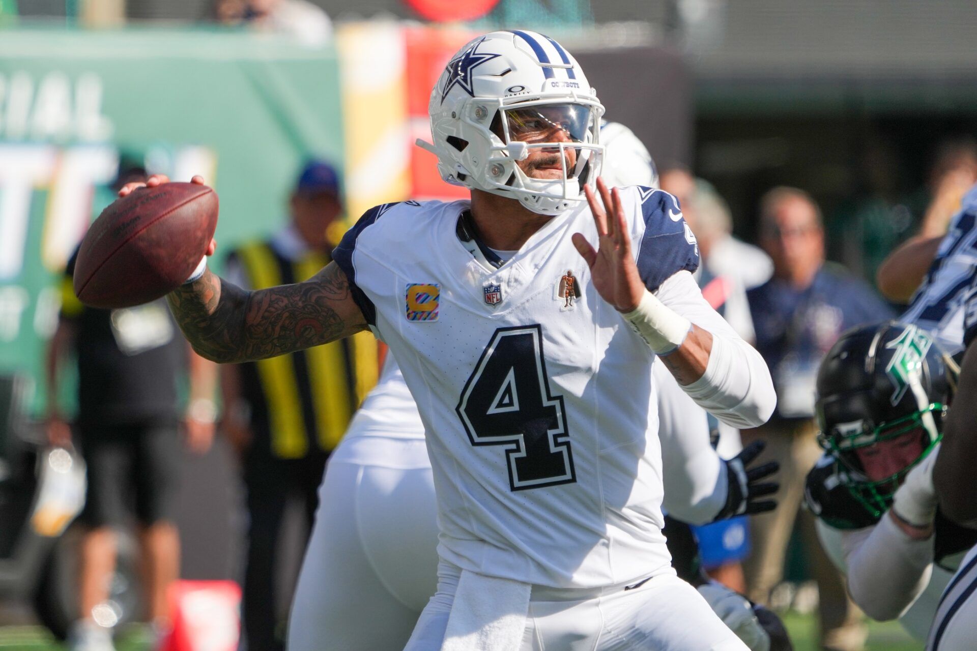 Dallas Cowboys quarterback Dak Prescott (4) throws down field against the New York Jets during the first half at MetLife Stadium.