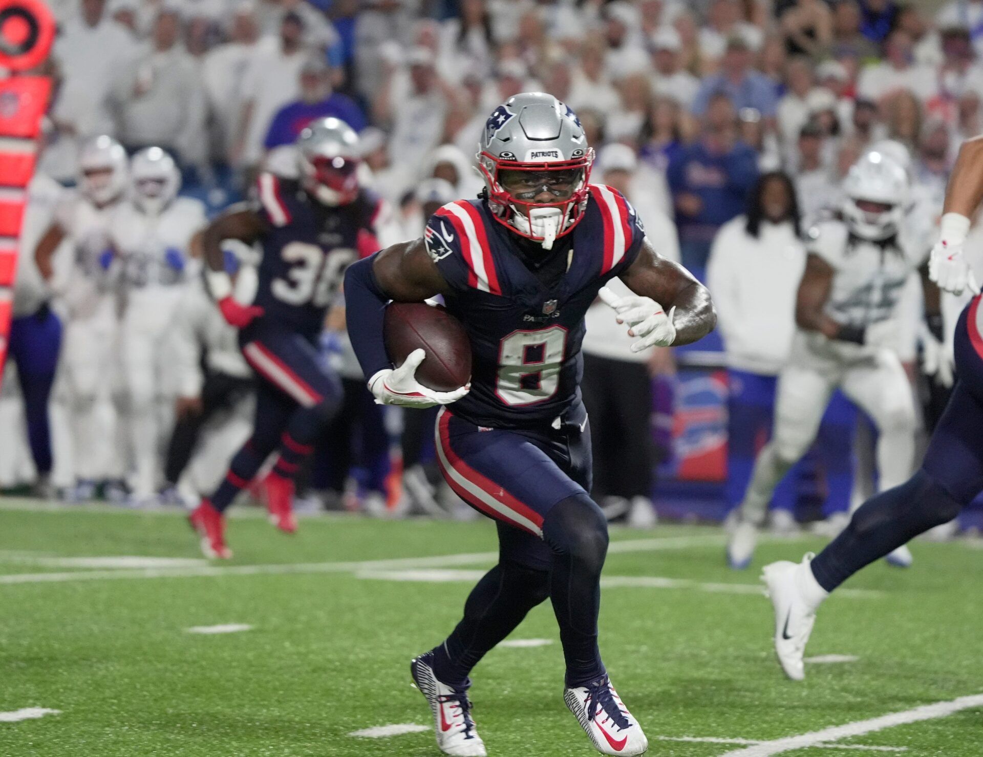 New England Patriots wide receiver Stefon Diggs gets about 10 yards on the play after catching a pass during second half action at Highmark Stadium in Orchard Park on Oct. 5, 2025.