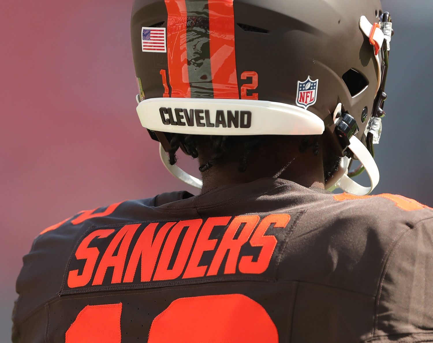 Cleveland Browns quarterback Shedeur Sanders is seen on the sideline wearing the team’s alternate Alpha Dawg helmet before an NFL football game at Huntington Bank Field, Sept. 21, 2025, in Cleveland, Ohio.