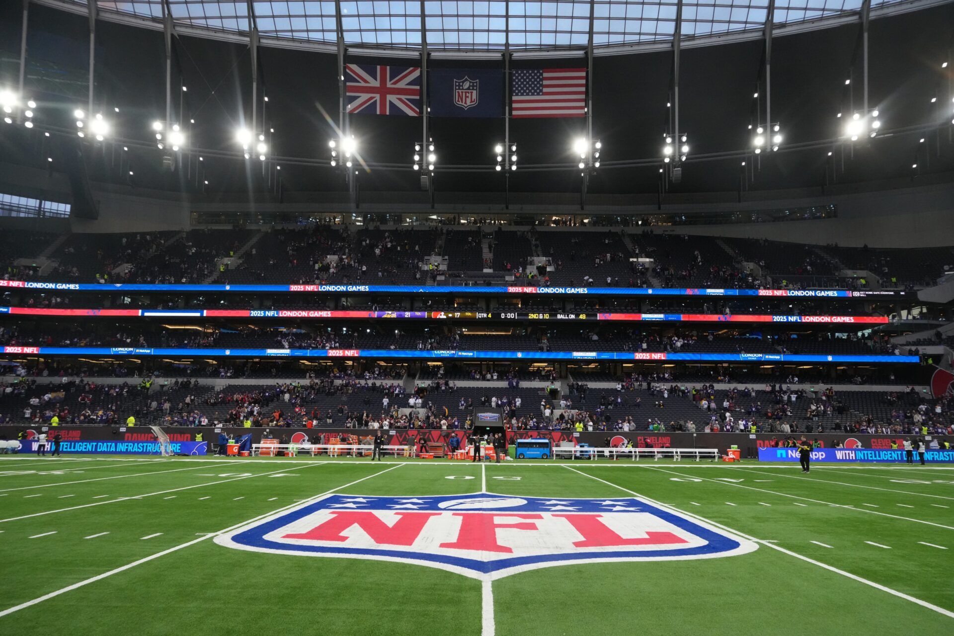 The British, NFL shield logo and the United States flags during an NFL International Series game at Tottenham Hotspur Stadium.