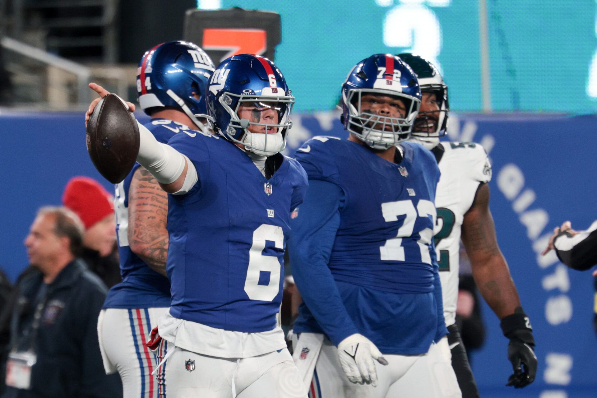 New York Giants quarterback Jaxson Dart (6) celebrates a first down against the Philadelphia Eagles during the third quarter of the game at MetLife Stadium.