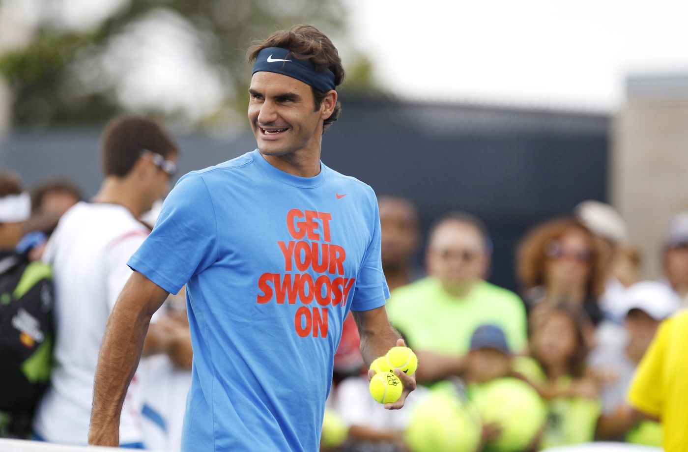 Roger Federer, smiles as he talks with Stanislas Wawrinka, both from Switzerland, before practice during the first day of the Western and Southern Open at the Lindner Family Tennis Center in Mason. Federer, who is ranked 5th by the ATP, has won the Western and Southern Open 5 times. Wawrinka is ranked 10th ATP. Photo shot Saturday August 10, 2013. The Enquirer/ Cara Owsley