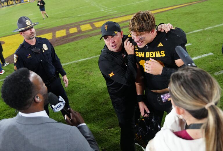 Arizona State quarterback Sam Leavitt (10) and head coach Kenny Dillingham celebrate after a win against TCU during a game at Mountain America Stadium in Tempe on Sept. 26, 2025.
