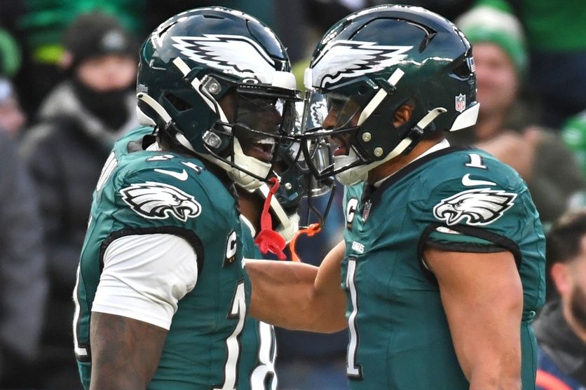 Philadelphia Eagles wide receiver A.J. Brown (11) and quarterback Jalen Hurts (1) celebrate a touchdown  against the Washington Commanders in the NFC Championship game at Lincoln Financial Field.