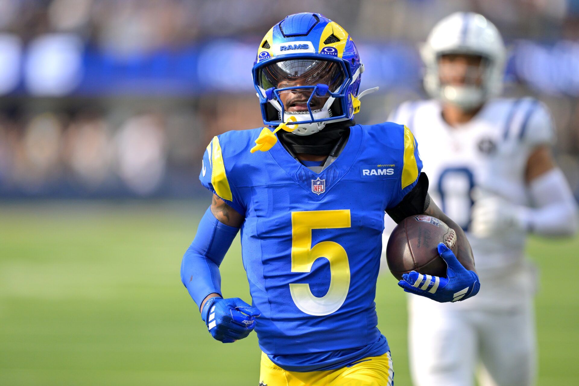 Los Angeles Rams wide receiver Tutu Atwell (5) runs for a touchdown on an 88 yard pass play in the fourth quarter against the Indianapolis Colts at SoFi Stadium.