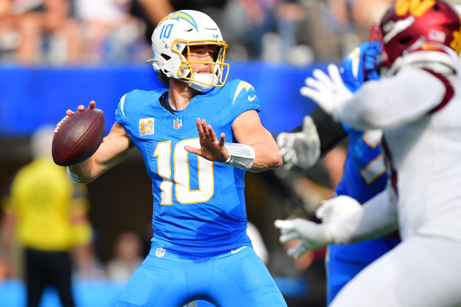 Los Angeles Chargers quarterback Justin Herbert (10) throws a pass against the Washington Commanders in the second half at SoFi Stadium.