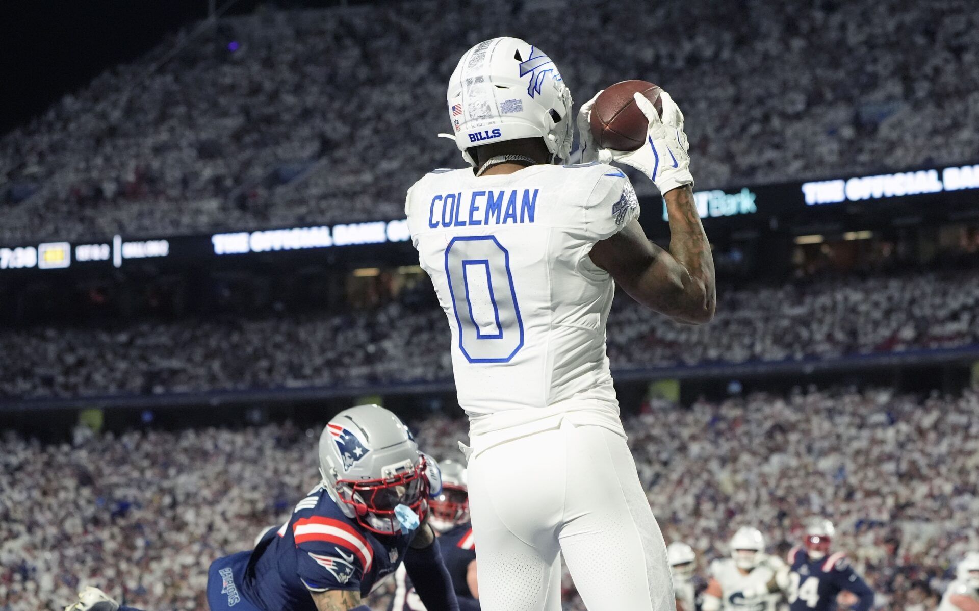 Buffalo Bills wide receiver Keon Coleman (0) makes a touchdown catch against the New England Patriots during the second half at Highmark Stadium.
