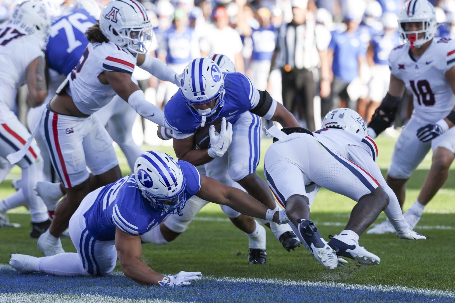 Brigham Young Cougars running back LJ Martin (27) runs for a touchdown against the Arizona Wildcats during the fourth quarter at LaVell Edwards Stadium.
