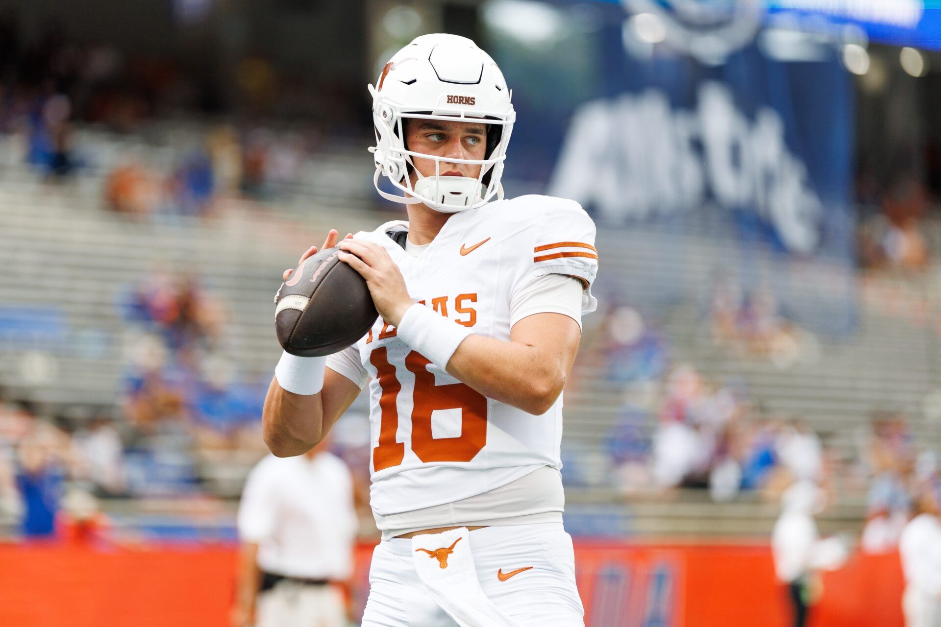 Texas Longhorns quarterback Arch Manning (16) throws the ball before a game against the Florida Gators at Ben Hill Griffin Stadium.