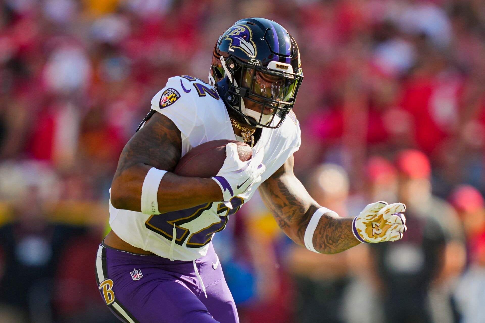 Baltimore Ravens running back Derrick Henry (22) runs the ball during the first half against the Kansas City Chiefs at GEHA Field at Arrowhead Stadium.