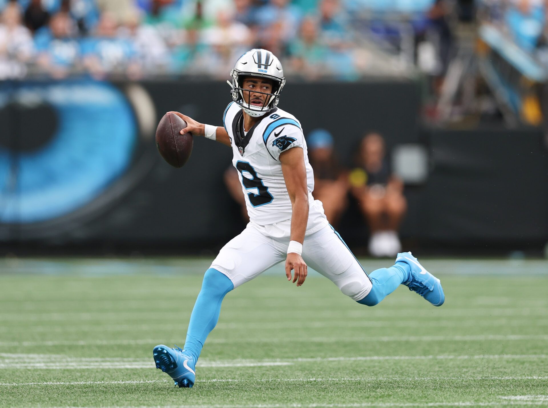 Carolina Panthers quarterback Bryce Young (9) scrambles during the second quarter against the Miami Dolphins at Bank of America Stadium.
