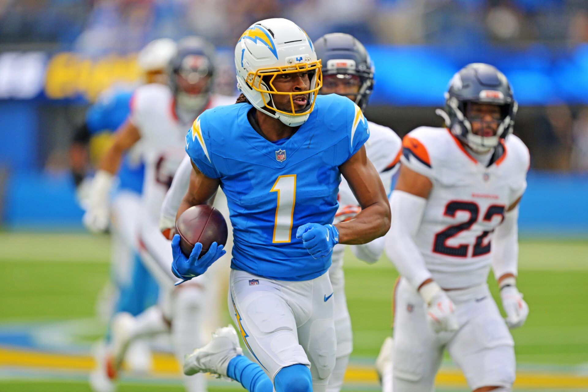 Los Angeles Chargers wide receiver Quentin Johnston (1) runs the ball during the first half against the Denver Broncos at SoFi Stadium.