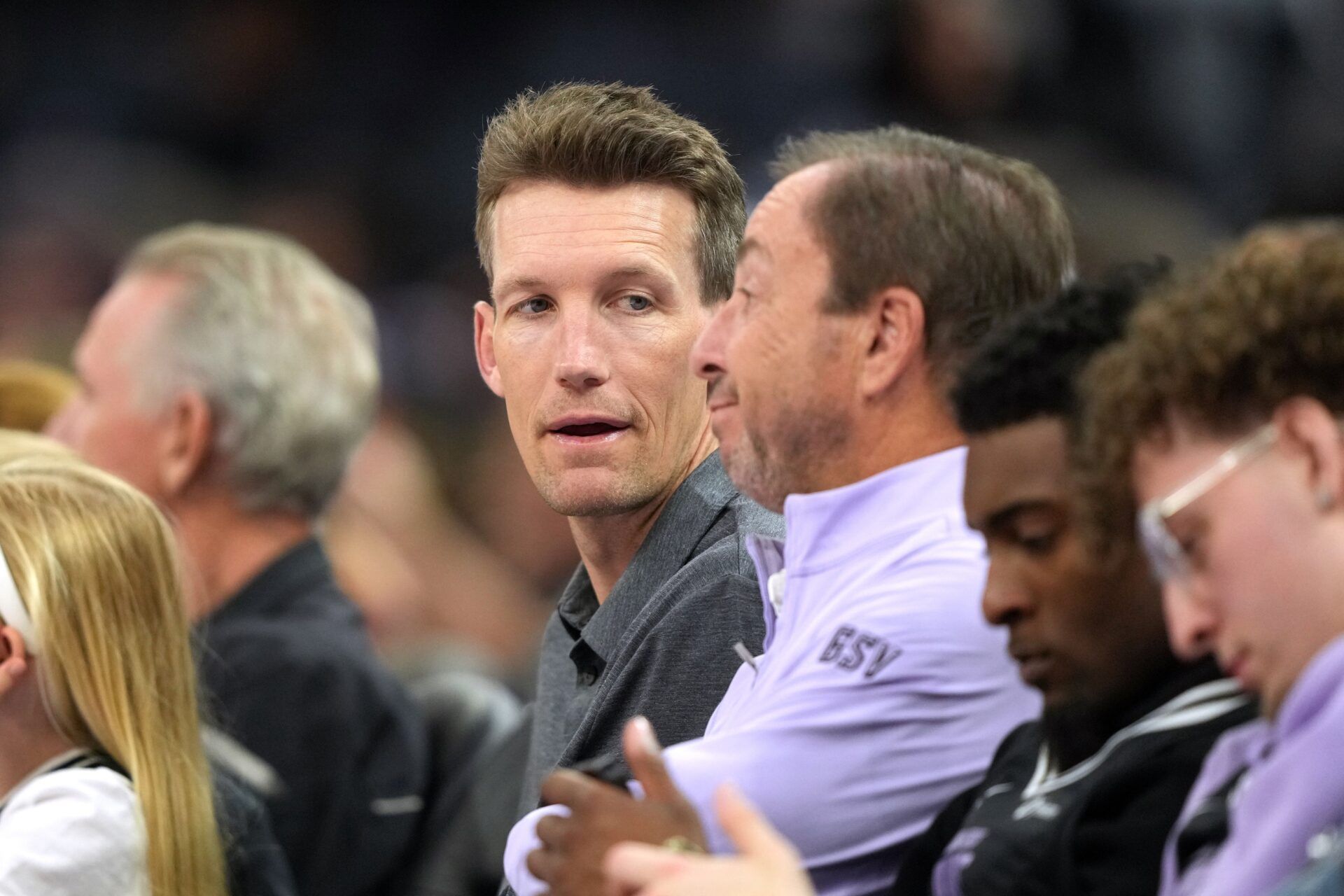 Golden State Warriors general manager Mike Dunleavy (center left) talks with Golden State Valkyries co-owner Joe Lacob (center right) during the fourth quarter against the Indiana Fever at Chase Center.