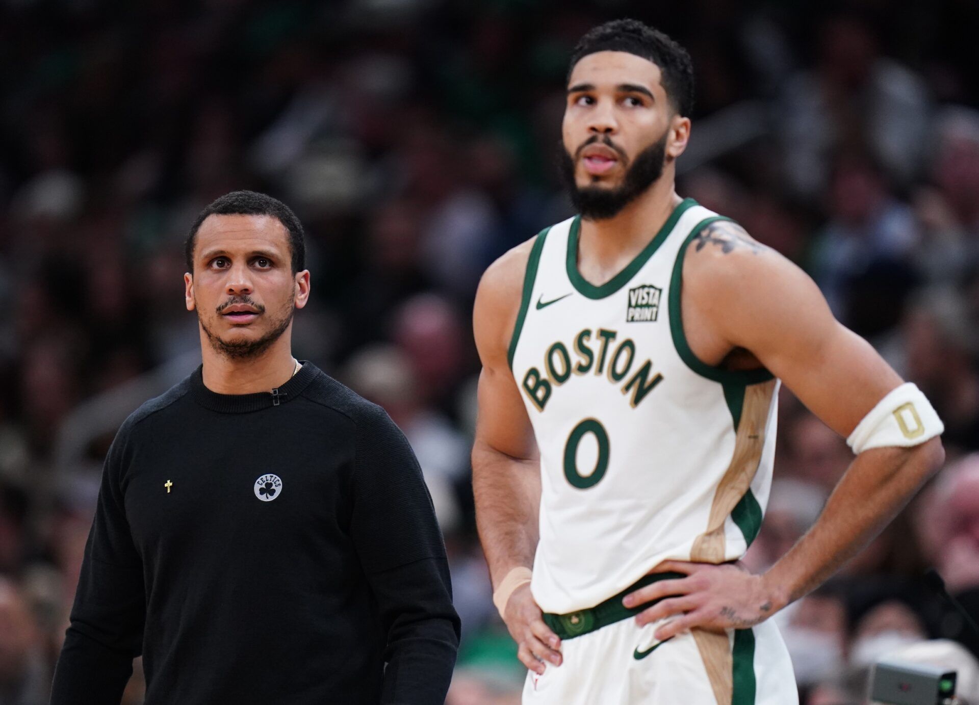 Boston Celtics head coach Joe Mazzulla with forward Jayson Tatum (0) look on from the sideline as they take on the Denver Nuggets at TD Garden.