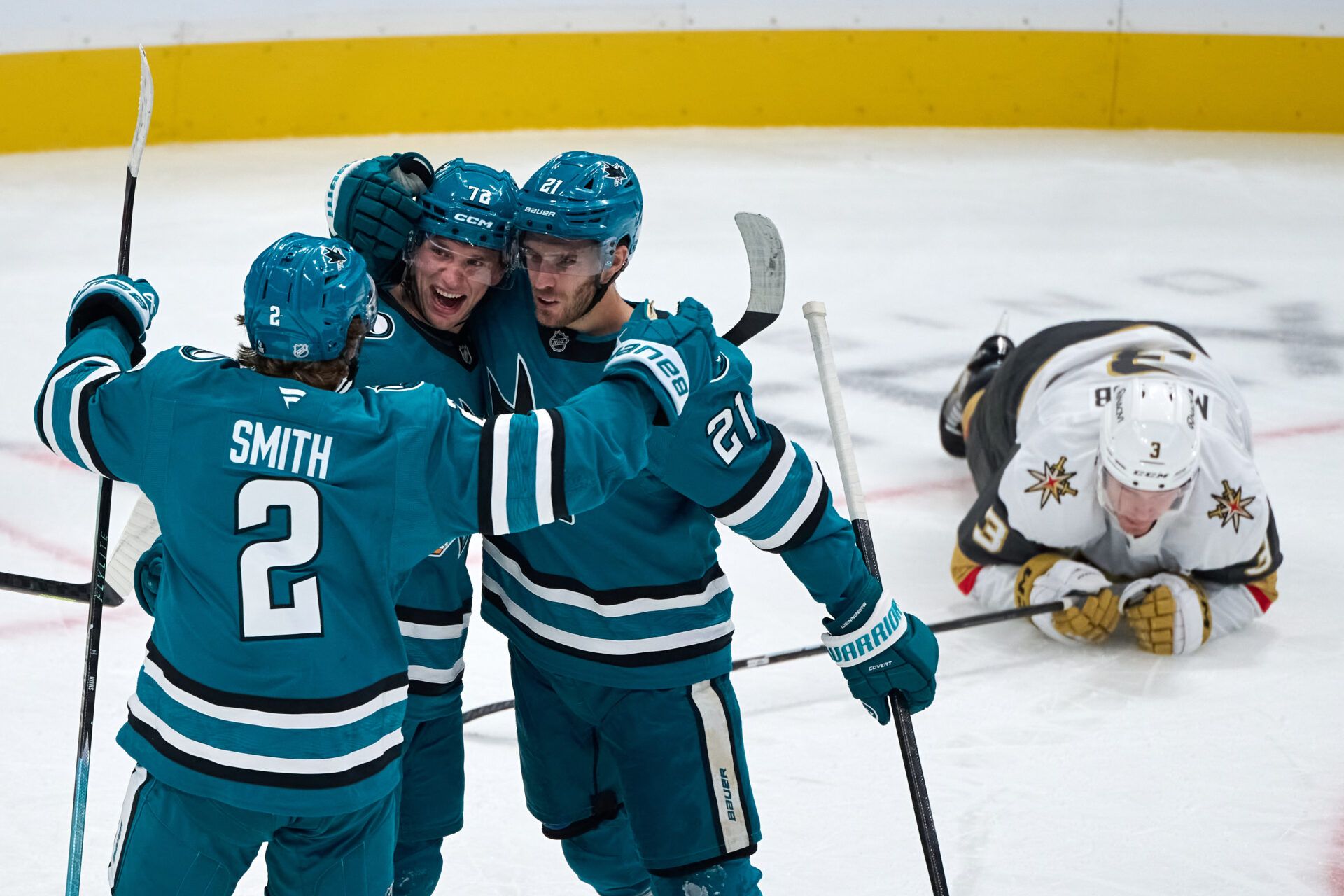 San Jose Sharks center Alexander Wennberg (21) celebrates with left wing William Eklund (72) and defenseman Will Smith (2) after scoring a goal against Vegas Golden Knights defenseman Brayden McNabb (3) and goaltender Akira Schmid (40) (not pictured) during the second period at SAP Center at San Jose.