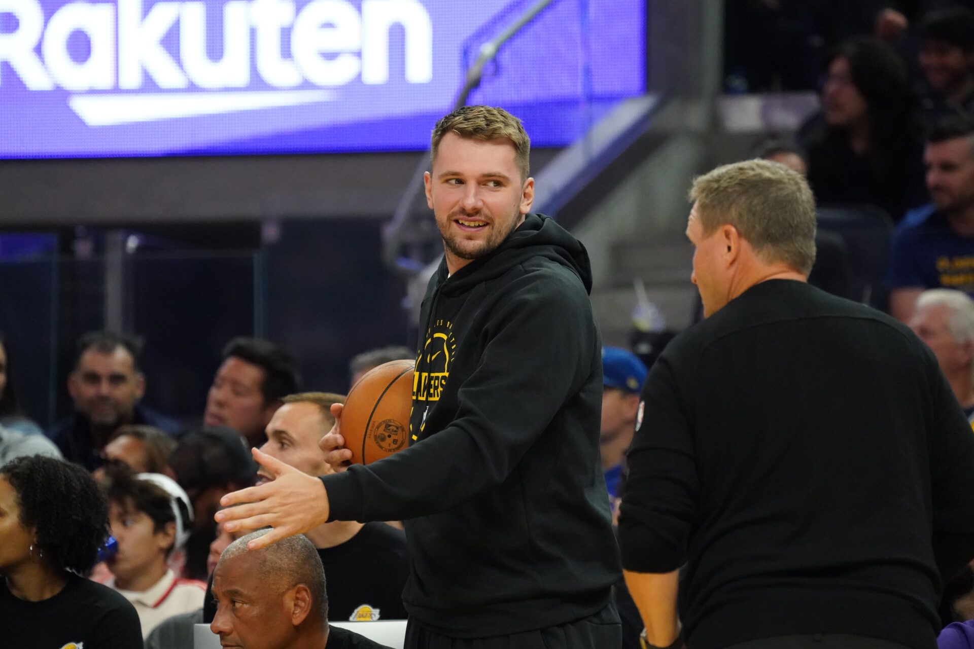 Los Angeles Lakers forward/guard Luka Doncic (77) watches the action from the bench during a game against the Golden State Warriors in the second quarter at Chase Center.