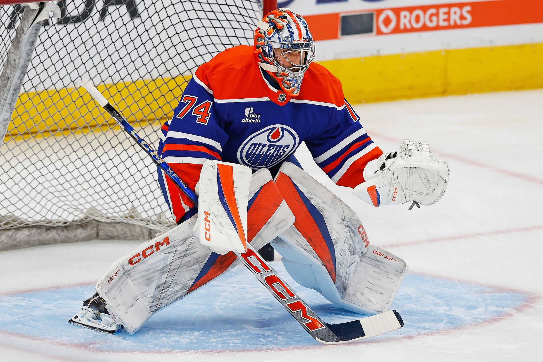 Edmonton Oilers goaltender Stuart Skinner (74) makes a save during warmup against the Calgary Flames at Rogers Place.