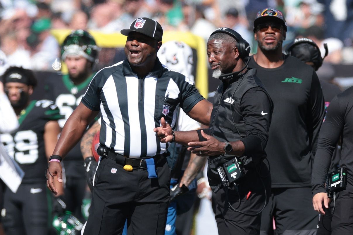 New York Jets head coach Aaron Glenn questions an official during the first half of a game  against the Dallas Cowboys at MetLife Stadium.