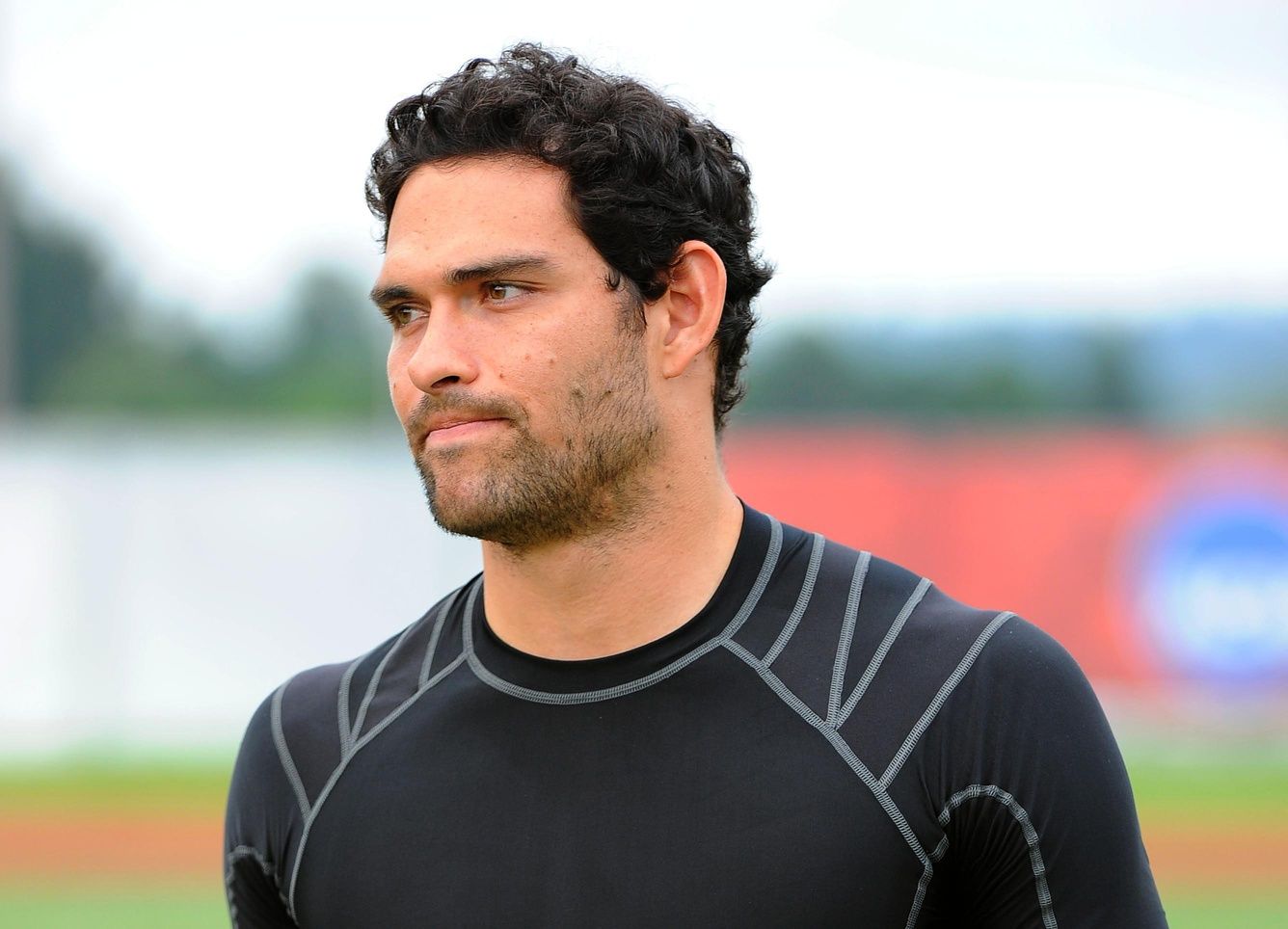New York Jets quarterback Mark Sanchez (6) walks back to the locker room following practice at SUNY Cortland.