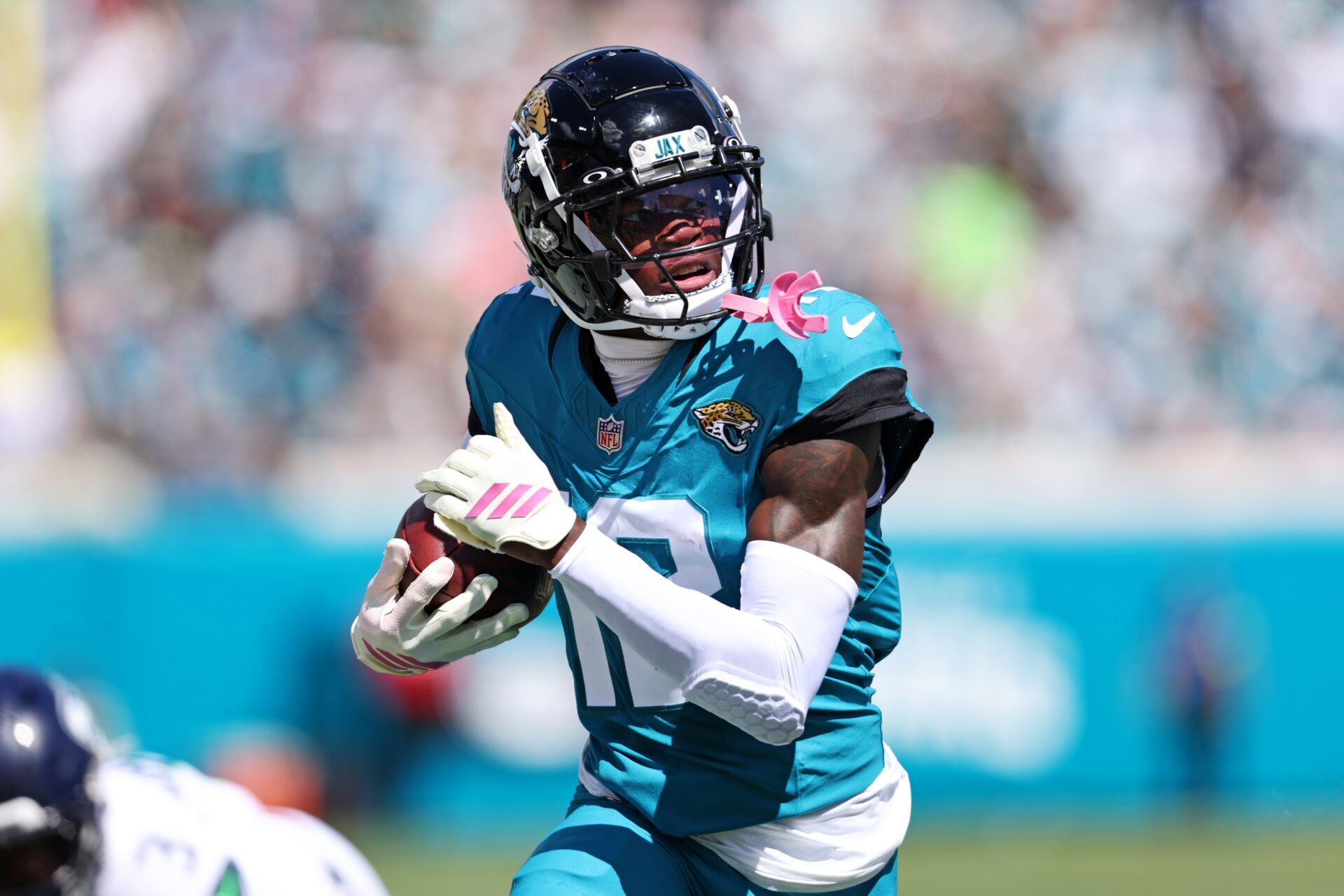 Jacksonville Jaguars wide receiver Travis Hunter (12) runs the ball during the first half against the Seattle Seahawks at EverBank Stadium.