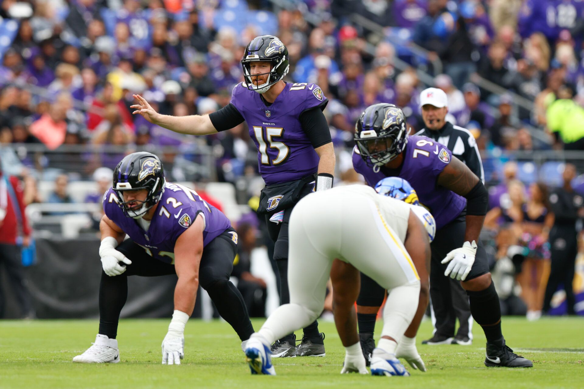 Baltimore Ravens quarterback Cooper Rush (15) calls a play at the line of scrimmage against the Los Angeles Rams during the first quarter of the game at M&T Bank Stadium.