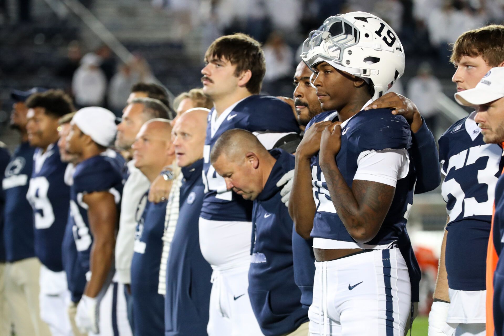 Penn State Nittany Lion players sing their alma mater following the game against the Northwestern Wildcats at Beaver Stadium.