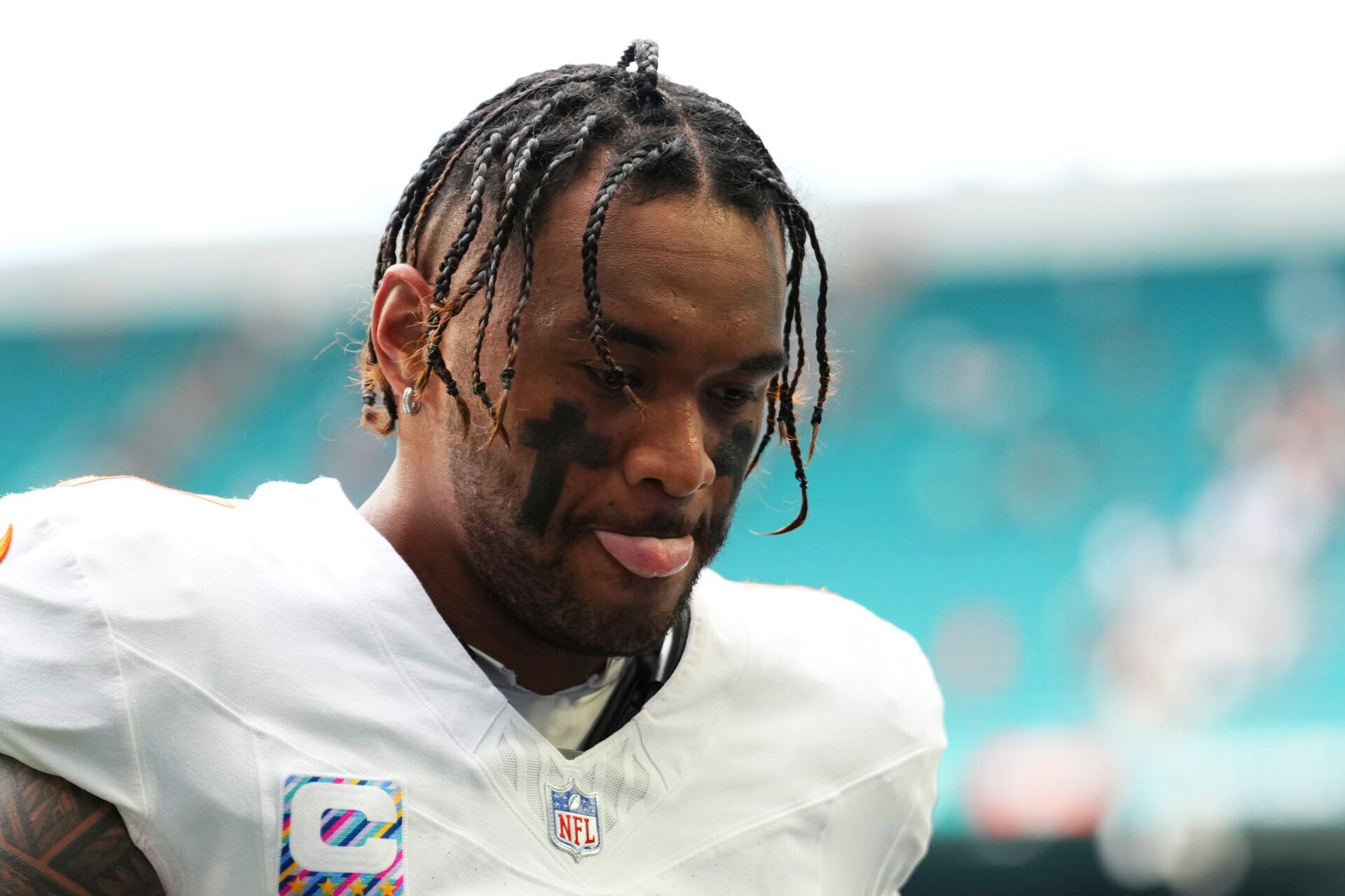 Miami Dolphins quarterback Tua Tagovailoa (1) leaves the field at the end of a game against the Los Angeles Chargers at Hard Rock Stadium.
