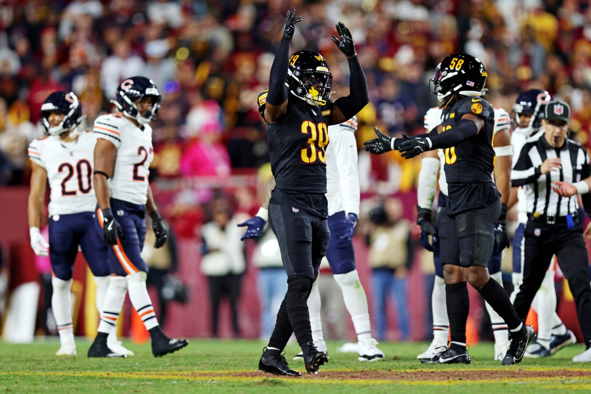 Washington Commanders safety Jeremy Reaves (39) reacts during the fourth quarter against the Chicago Bears at Commanders Field.