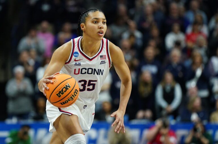 UConn Huskies guard Azzi Fudd (35) drives the ball against the Arkansas State Red Wolves in the first half at Harry A. Gampel Pavilion.