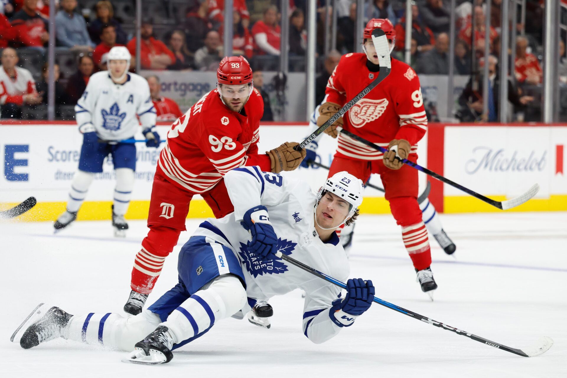 Toronto Maple Leafs left wing Matthew Knies (23) slips to the ice in the third period against the Detroit Red Wings at Little Caesars Arena.