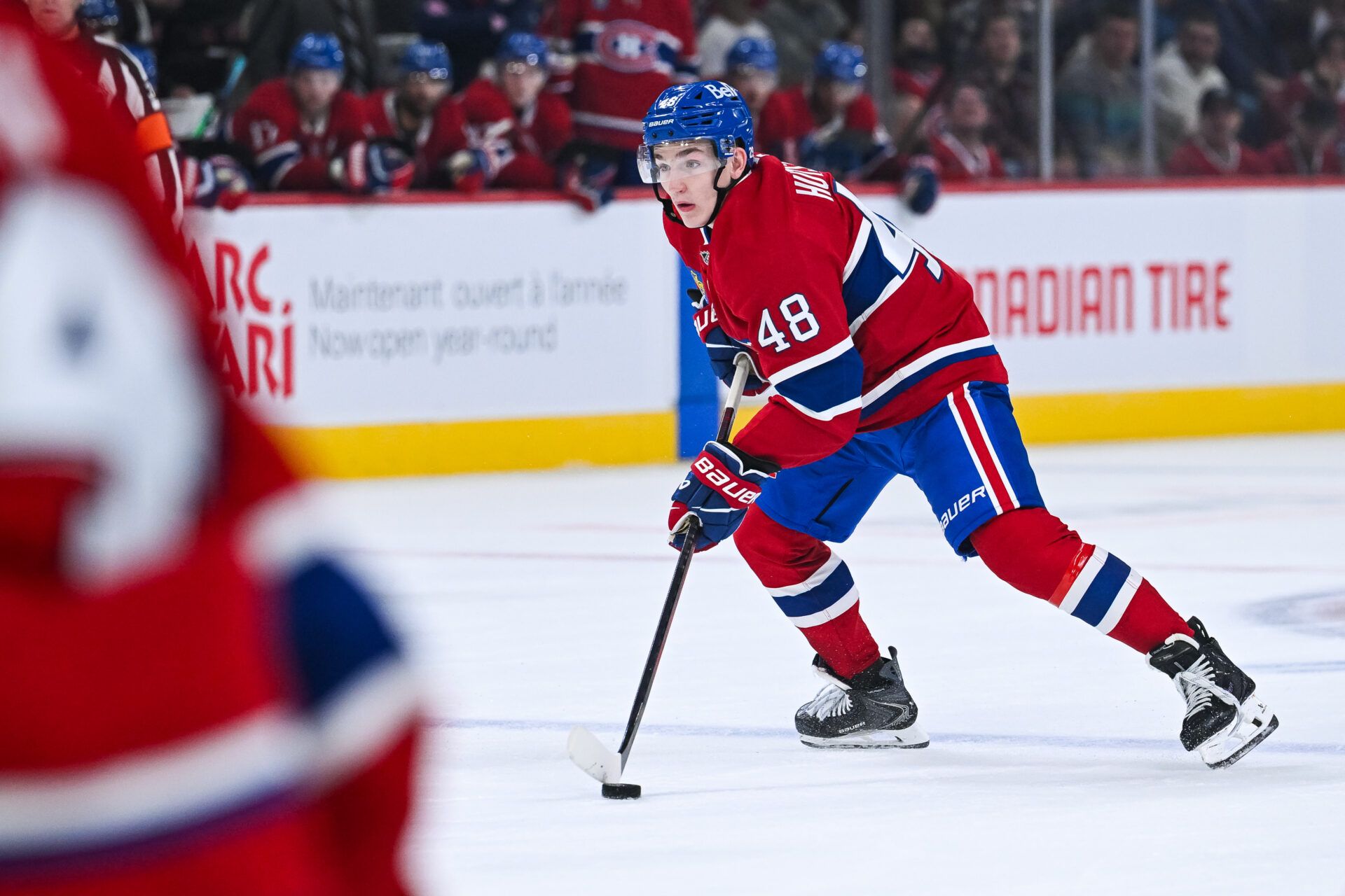 Montreal Canadiens defenseman Lane Hutson (48) plays the puck against the Ottawa Senators during the third period at Bell Centre.