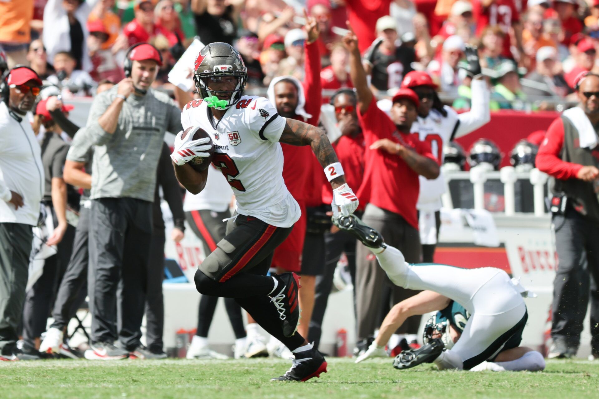 Tampa Bay Buccaneers wide receiver Emeka Egbuka (2) runs the ball during the second half against the Philadelphia Eagles  at Raymond James Stadium.
