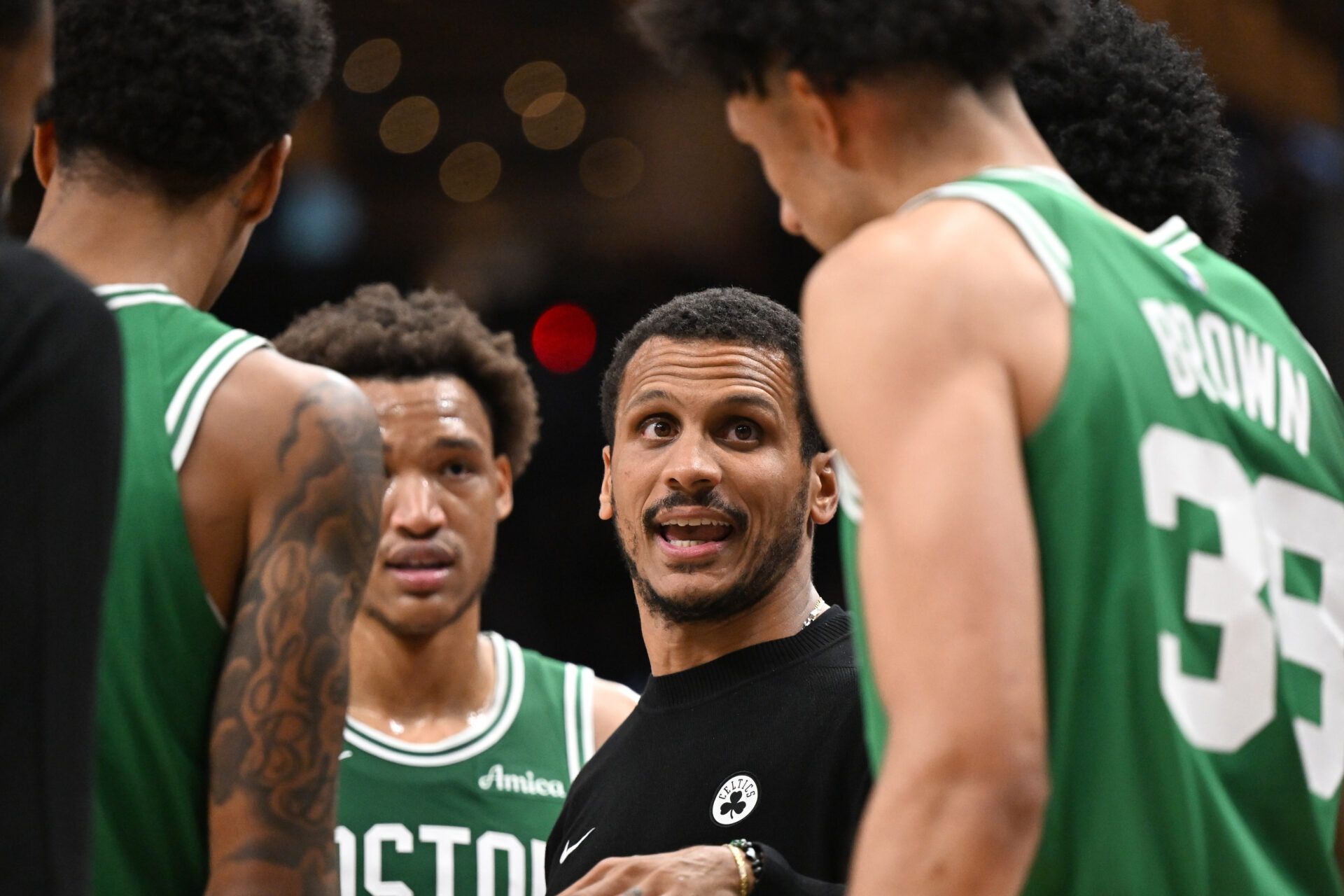 Boston Celtics head coach Joe Mazzulla speaks with his players in the second half against the Toronto Raptors at Scotiabank Arena.