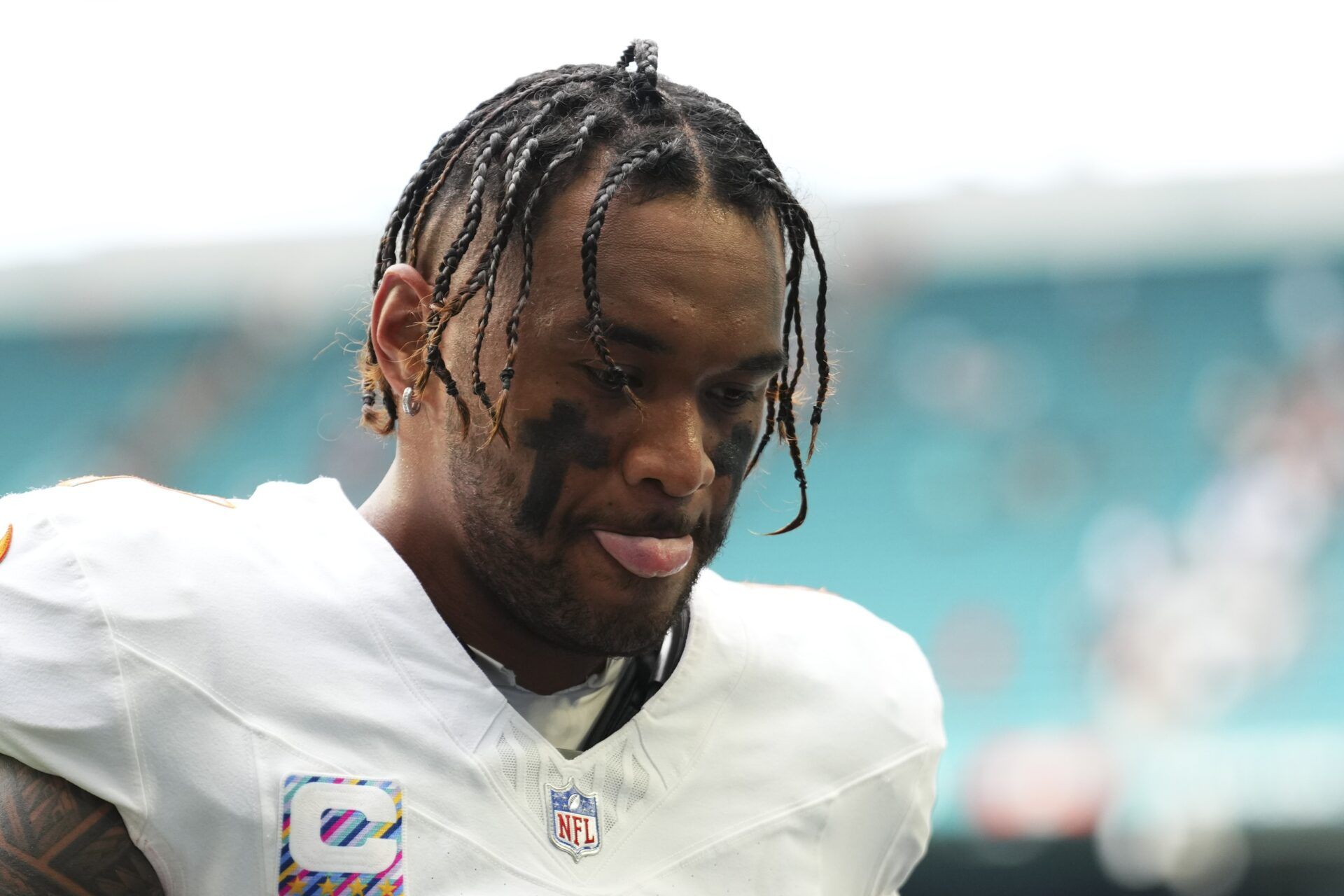 Miami Dolphins quarterback Tua Tagovailoa (1) leaves the field at the end of a game against the Los Angeles Chargers at Hard Rock Stadium.