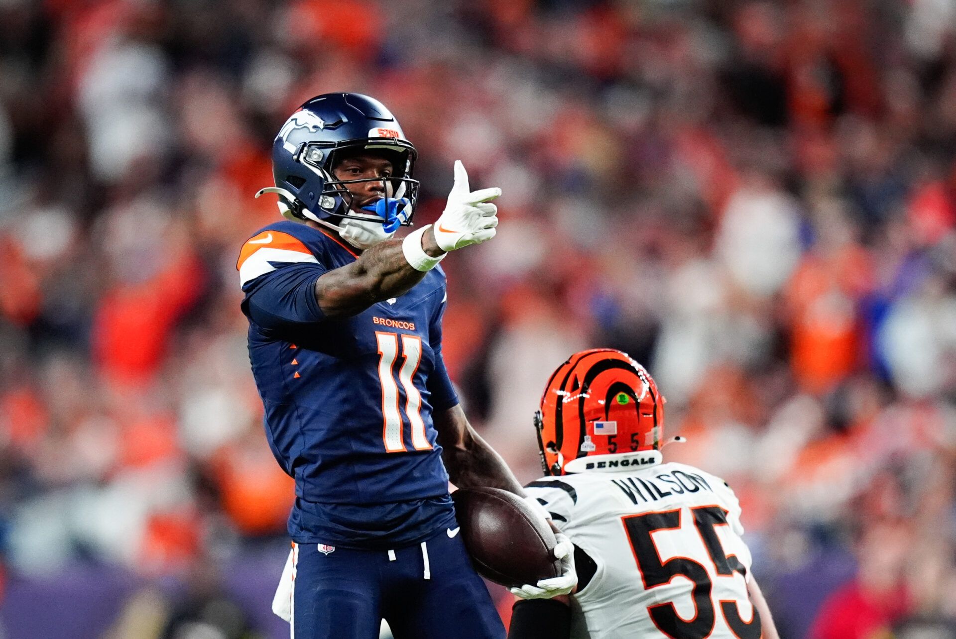 Denver Broncos wide receiver Troy Franklin (11) celebrates after making a catch during the second quarter against the Cincinnati Bengals at Empower Field at Mile High.