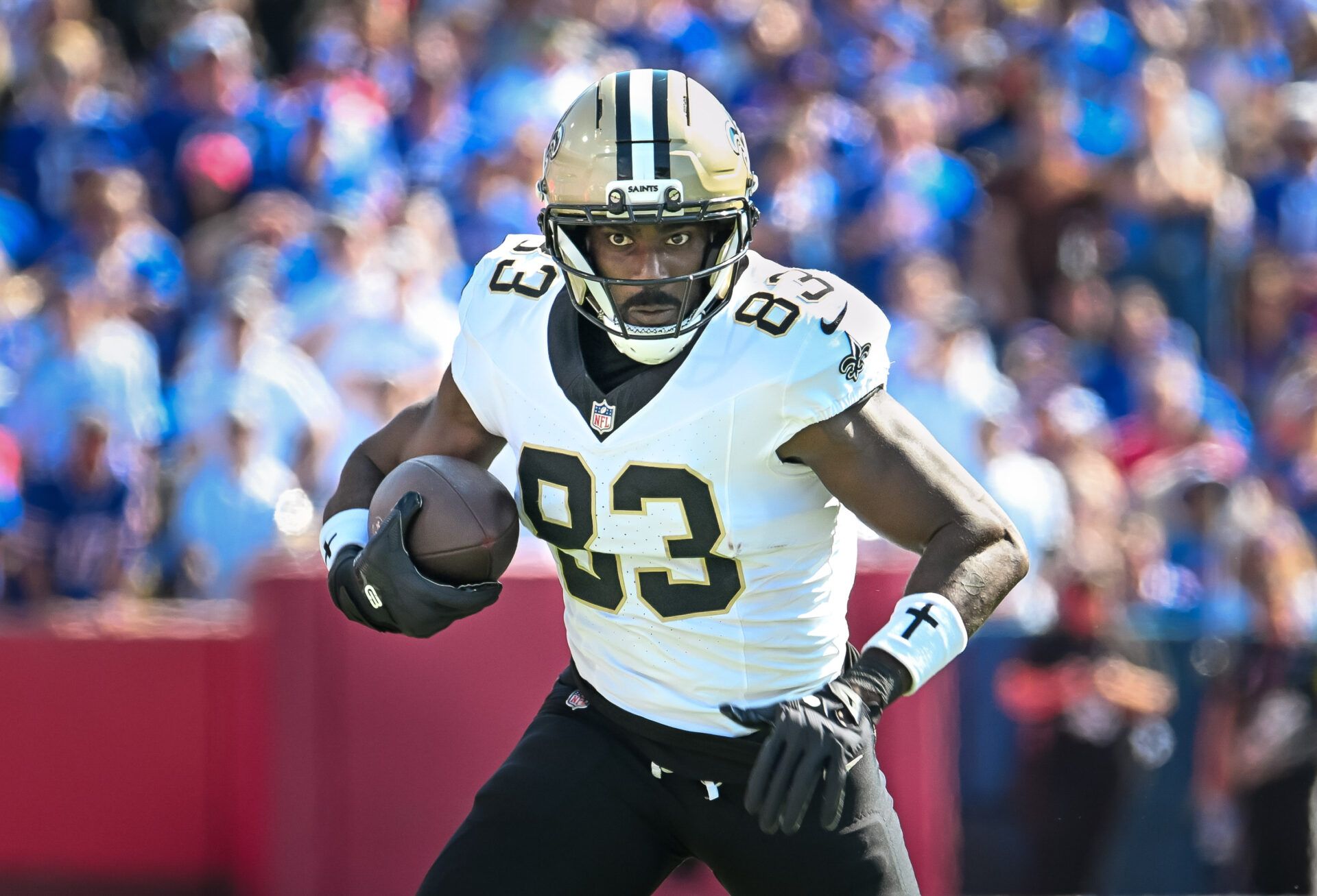 New Orleans Saints tight end Juwan Johnson (83) runs after making a catch against the Buffalo Bills in the first quarter at Highmark Stadium.