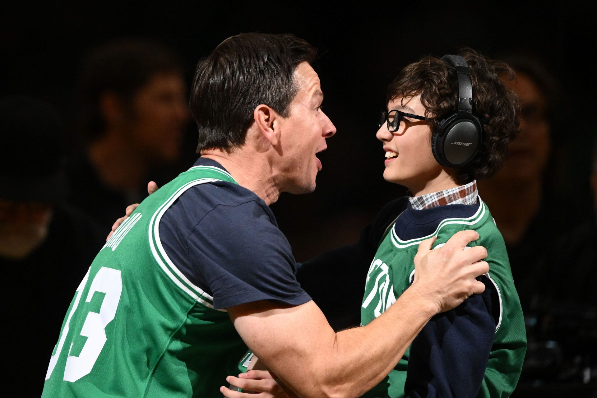 Actor Mark Wahlberg films for an upcoming movie during half time of a game between the Cleveland Cavaliers and the Boston Celtics at the TD Garden.