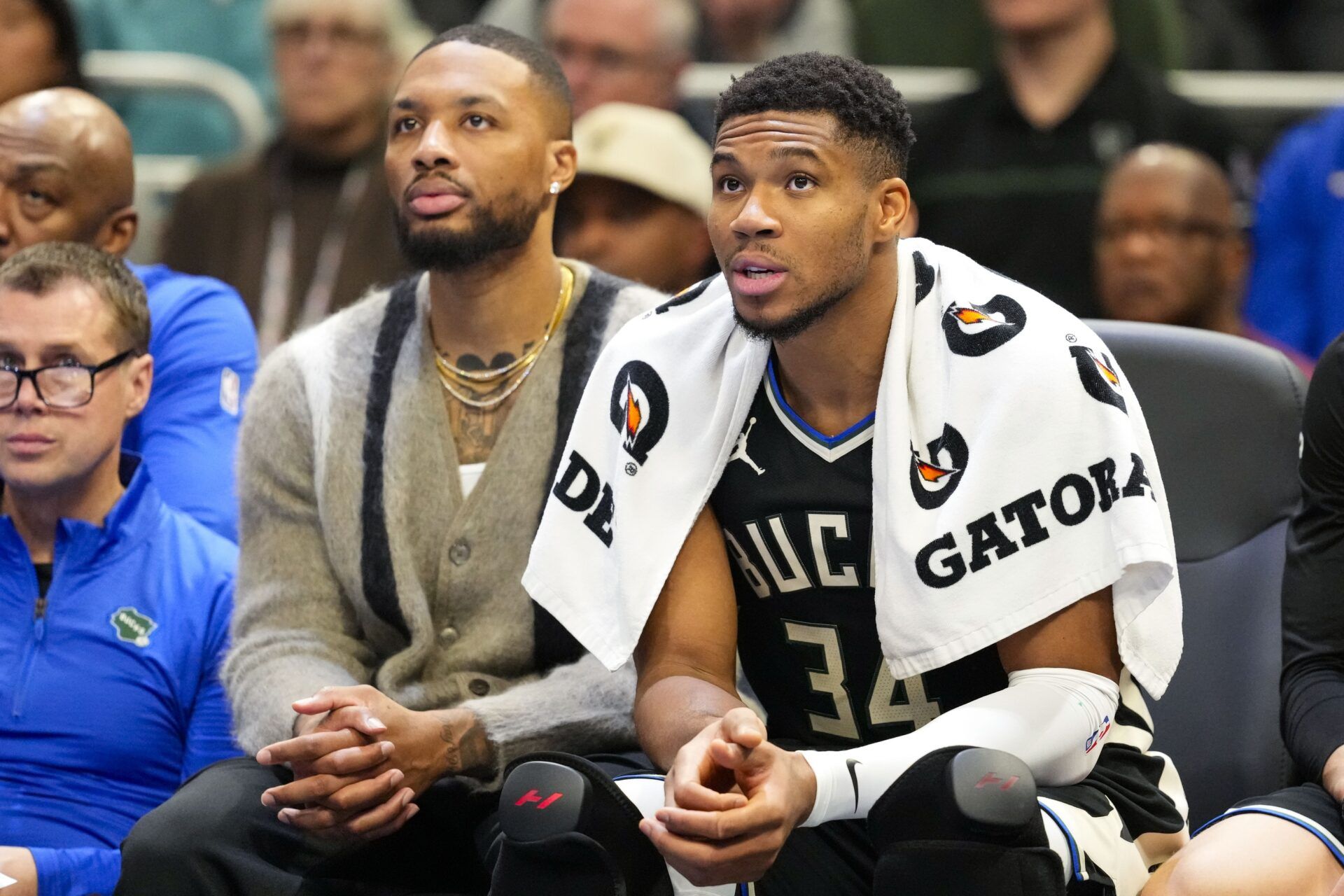 Milwaukee Bucks forward Giannis Antetokounmpo (34) sits with guard Damian Lillard on the bench during the fourth quarter against the Toronto Raptors at Fiserv Forum.