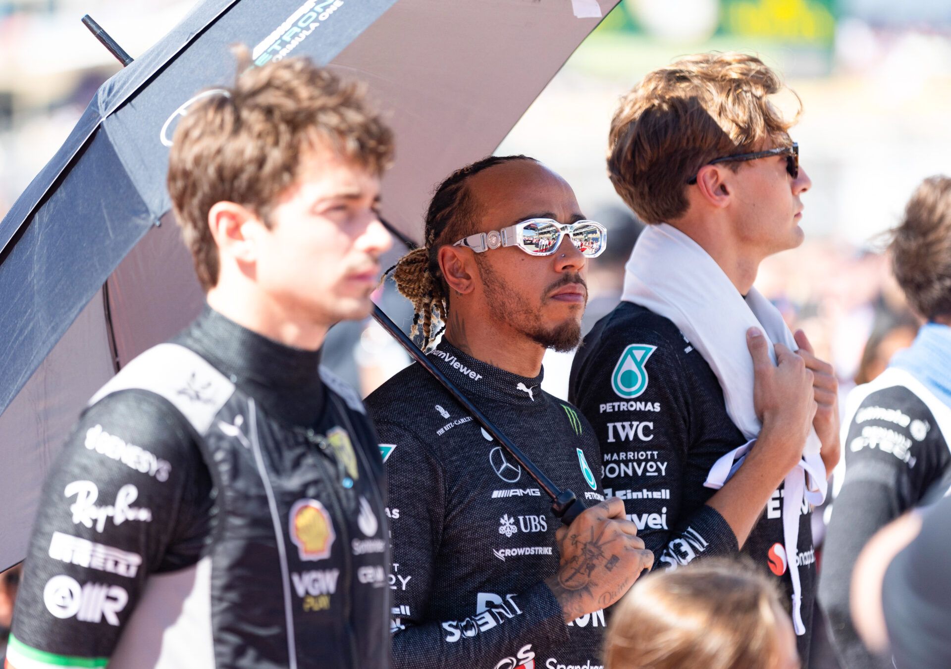 From left, Charles Leclerc of Ferrari, Lewis Hamilton and Mercedes teammate George Russell before the start of the Formula 1 United States Grand Prix at Circuit of the Americas.