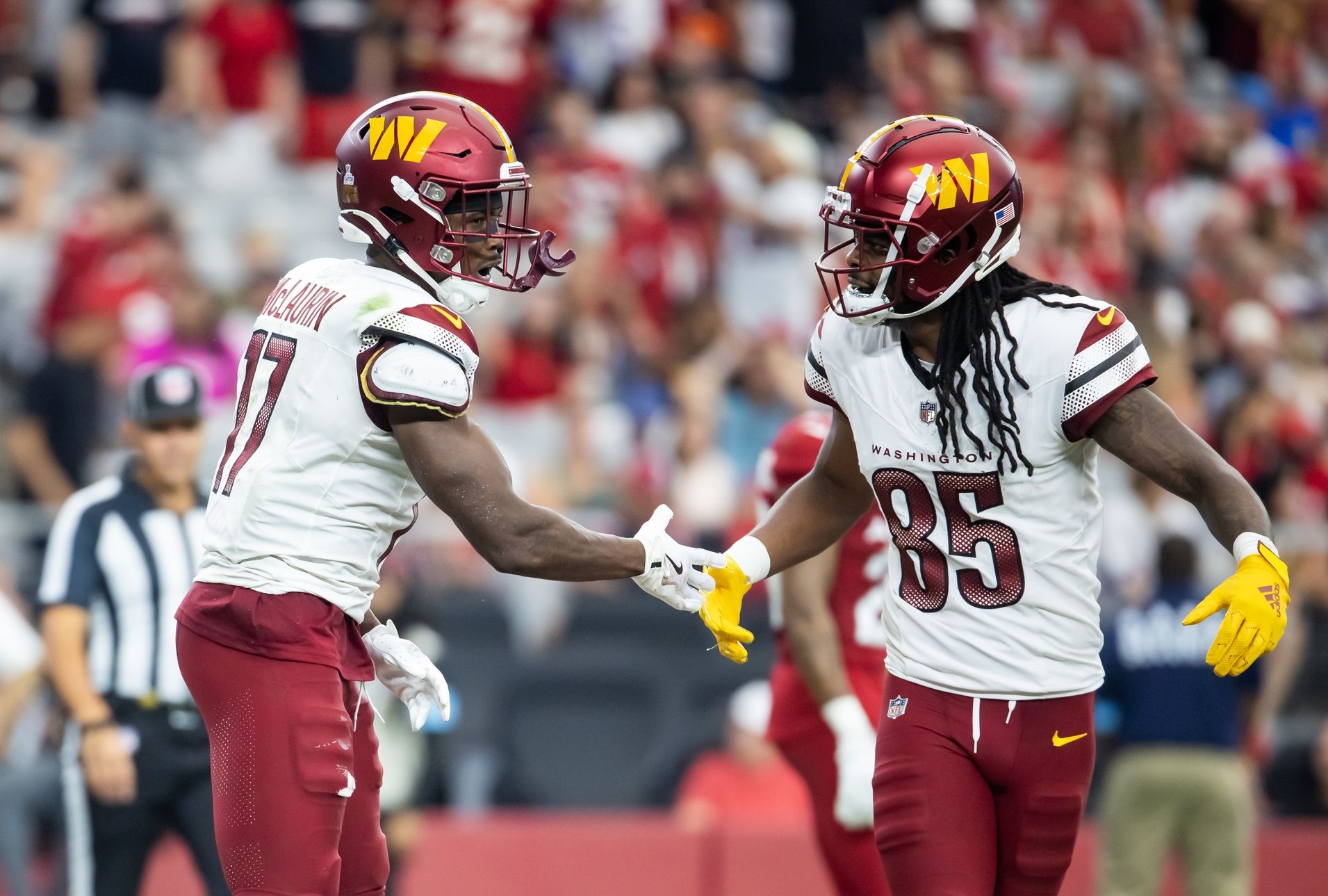 Washington Commanders wide receiver Terry McLaurin (17) celebrates a touchdown with Noah Brown (85) against the Arizona Cardinals in the second half at State Farm Stadium.