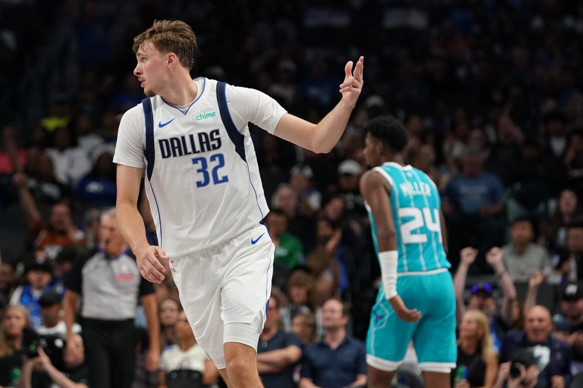 Dallas Mavericks forward Cooper Flagg (32) reacts after making a basket against the Charlotte Hornets in the first half of a game at American Airlines Center.